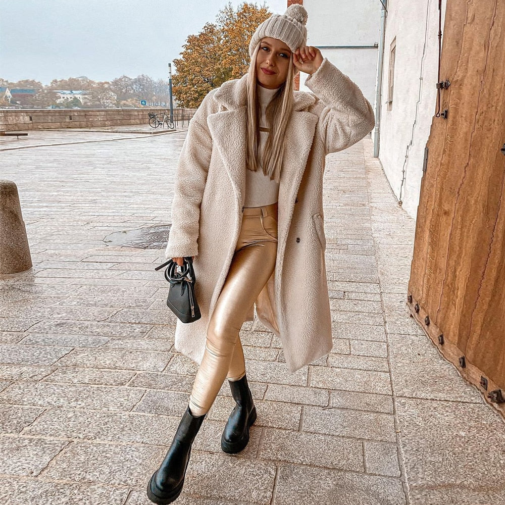 Elegant Gold Leather Pants, legs crossed